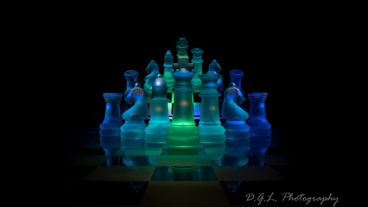 1280x720 Photograph A Glowing Glass Chess Set