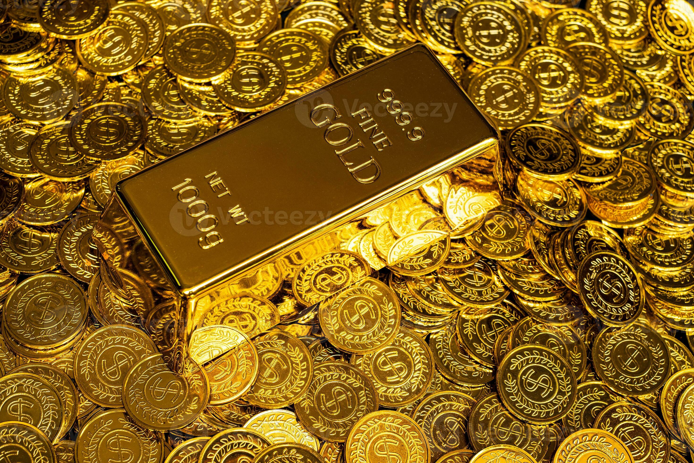 2940x1960 Gold bars are placed on a pile of gold coins
