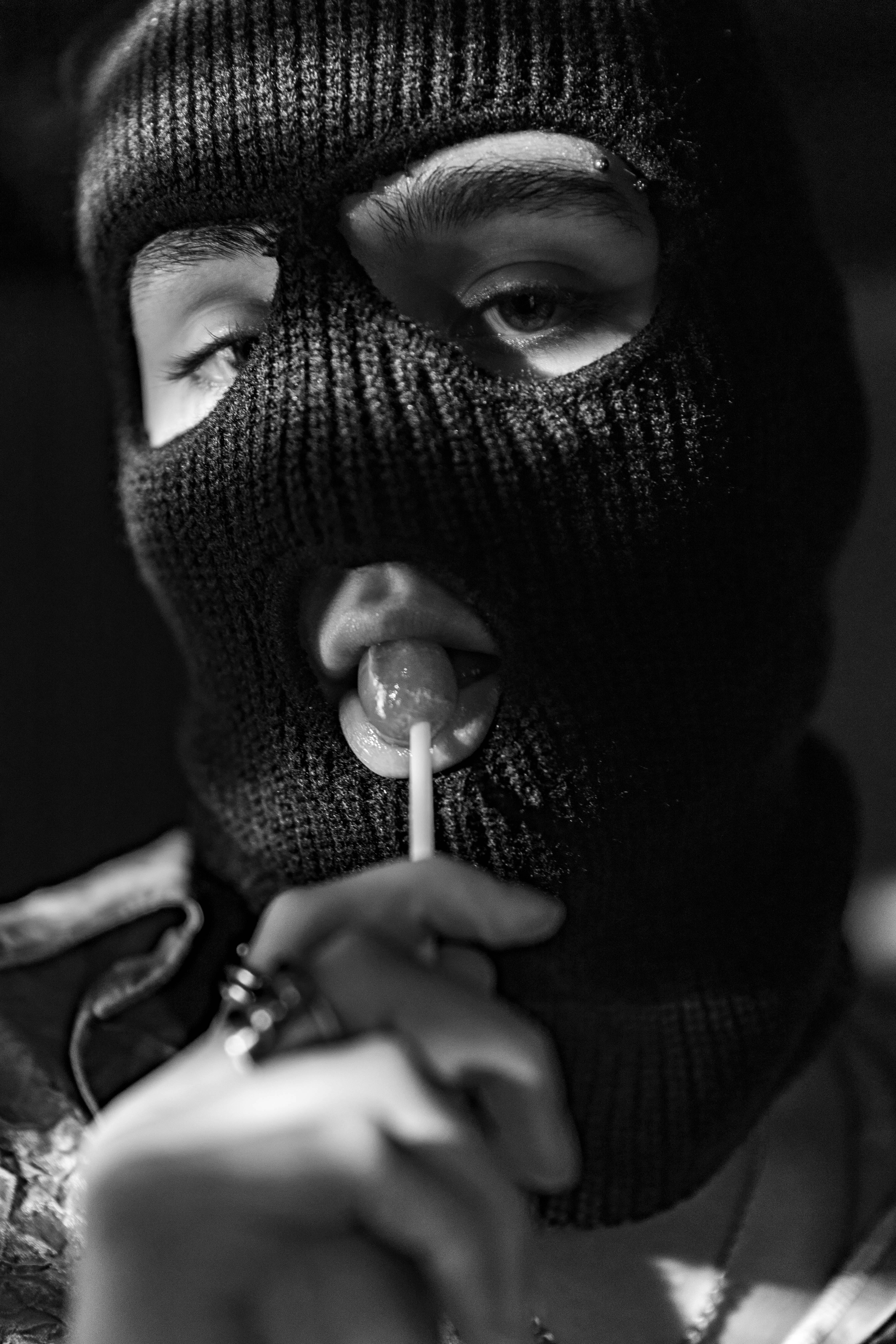 4480x6720 Person Wearing Ski Mask Eating Lollipop · Free
