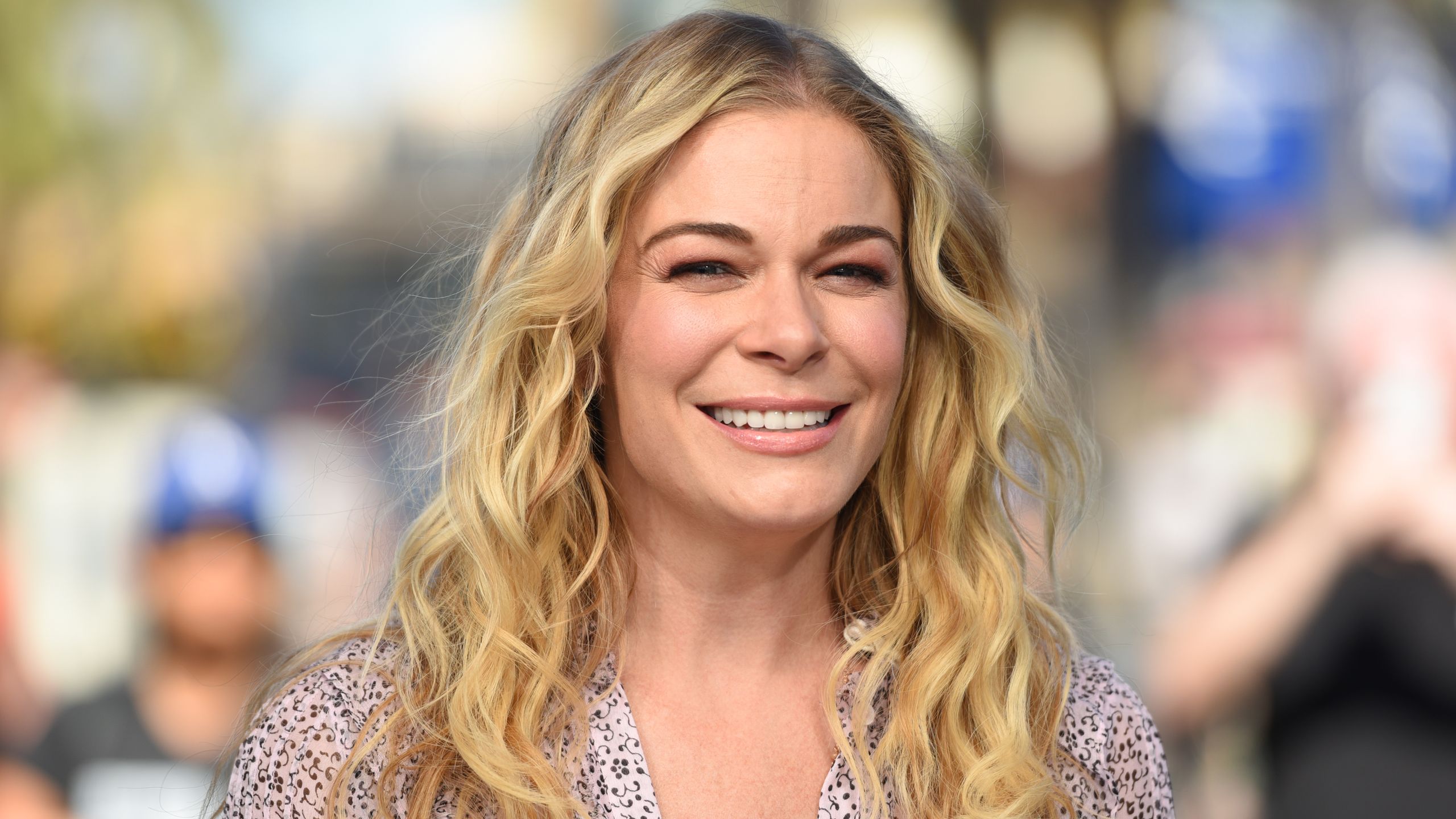 2560x1440 LeAnn Rimes Criticized for Not Capitalizing G in New “God's Work” Tattoo