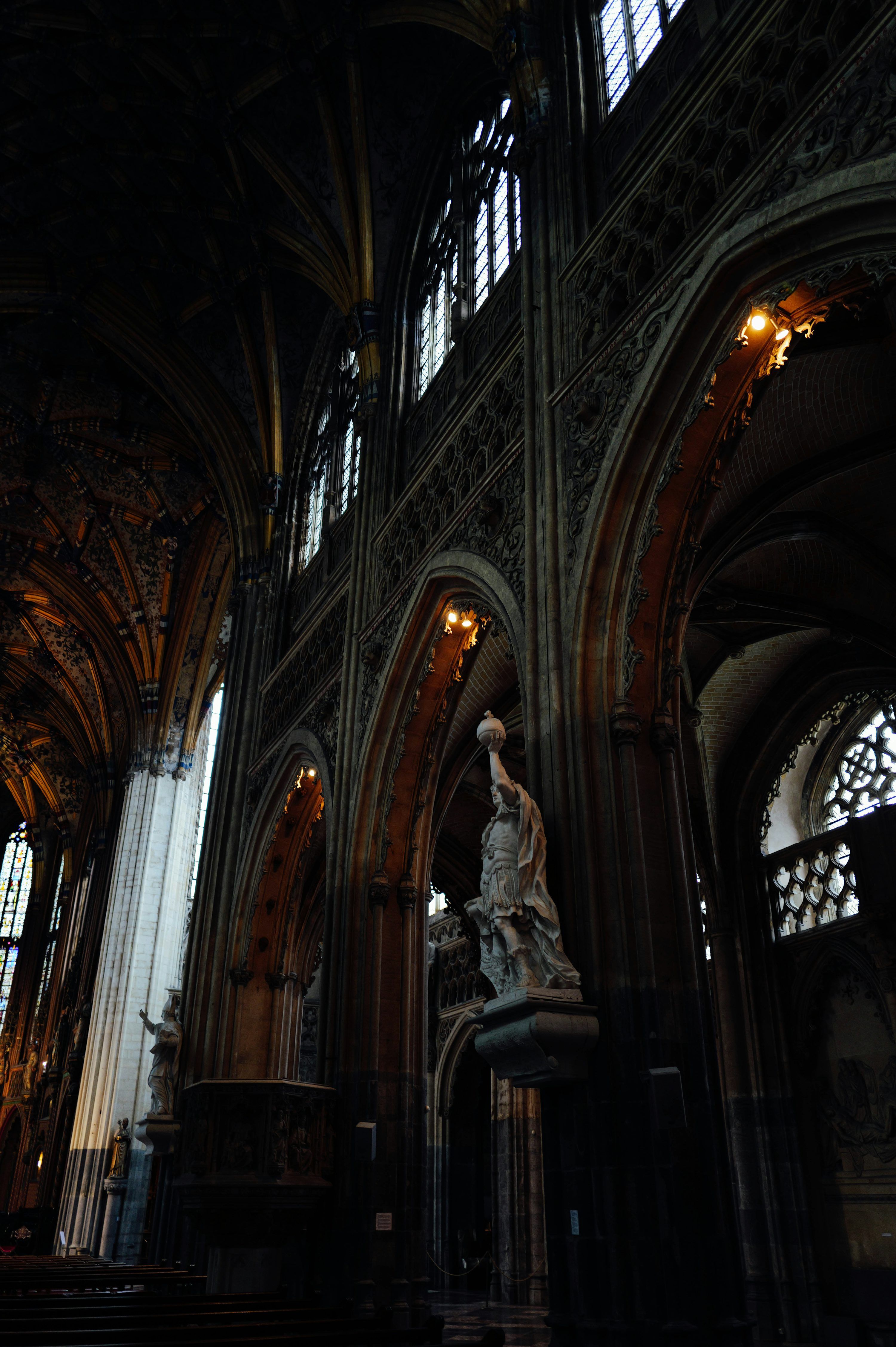 3000x4508 A cathedral with a statue in the middle of it photo