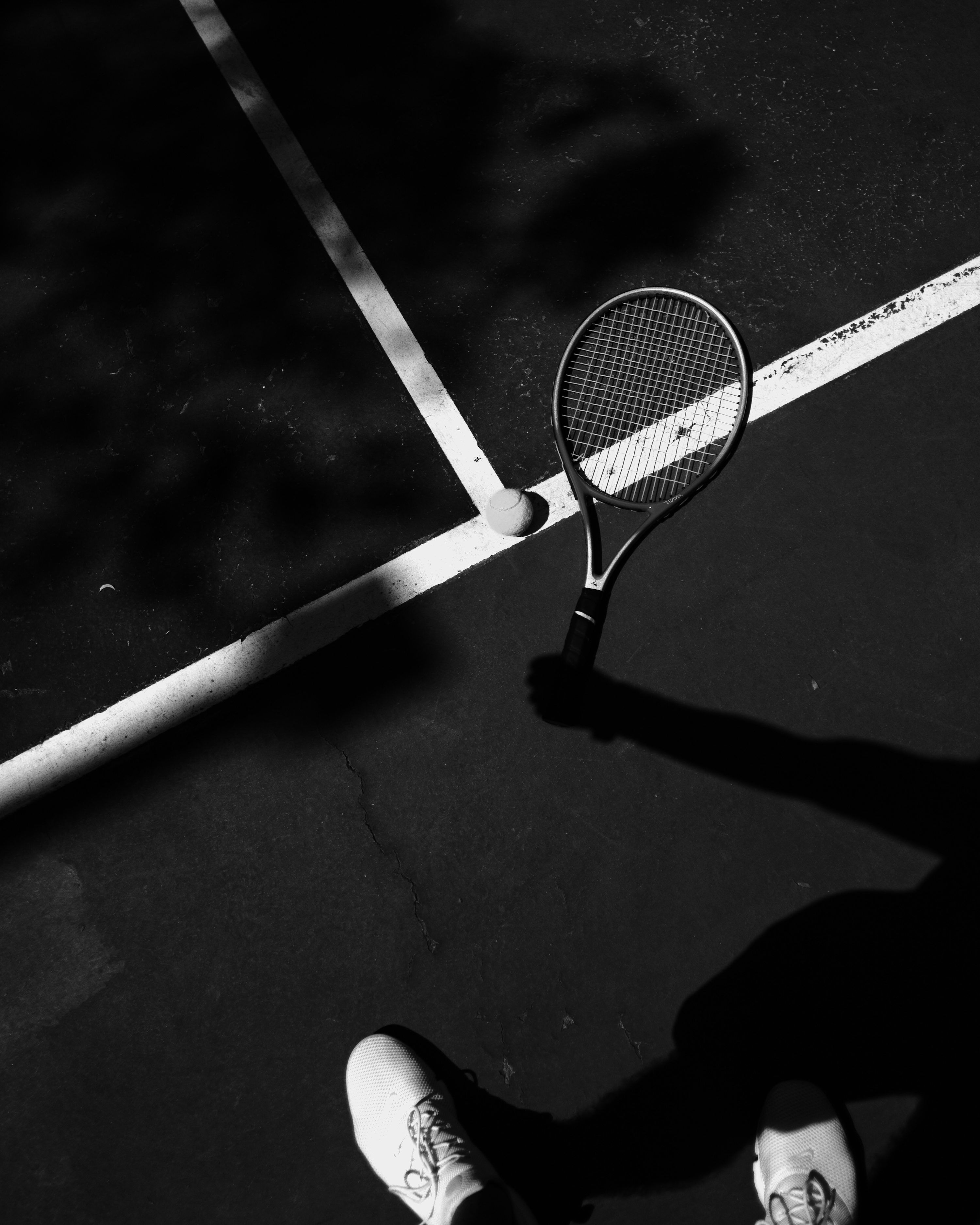 3000x3750 A tennis player is holding a racket photo