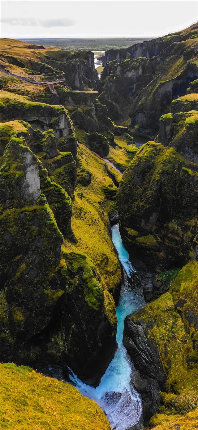 640x1385 river in the middle of green and yellow mountains iPhone X Wallpaper Free Download