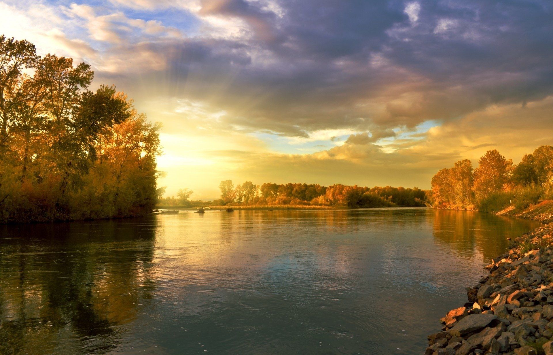 1920x1232 Autumn Sunbeams: Golden River at Sunrise