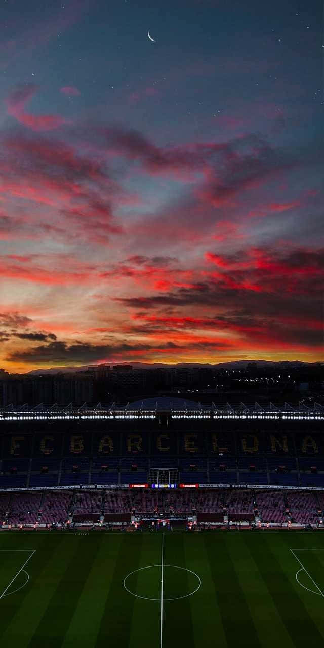 640x1280 Download Sunset Over Barcelona Stadium Football Aesthetics Wallpaper