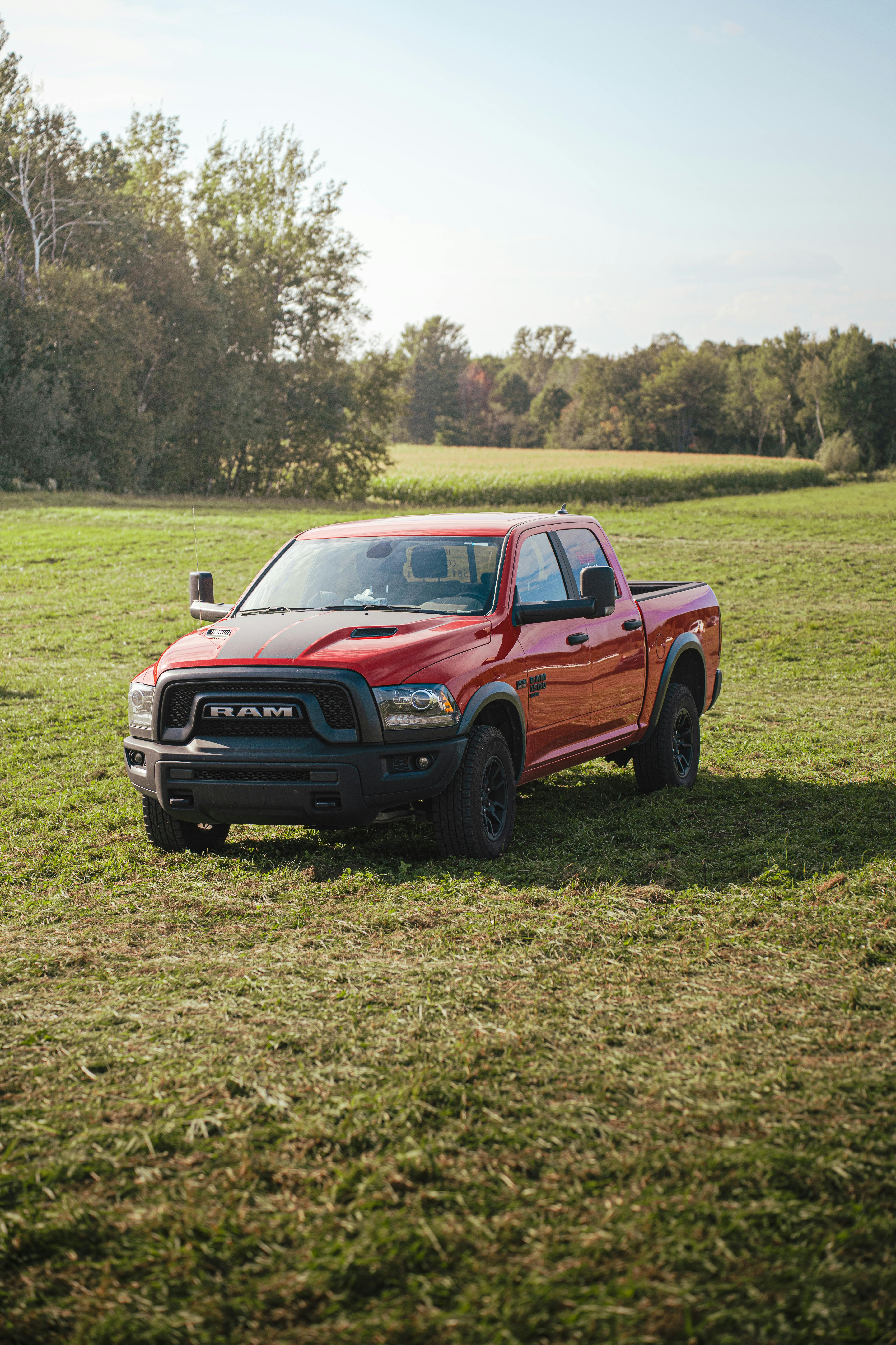 4672x7008 Red Pickup Truck Ram Rebel Parked in a Pasture · Free