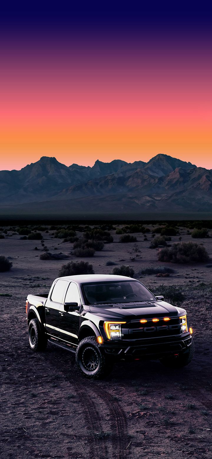 720x1560 Black Ford truck in the dark desert 4K Phone Wallpaper
