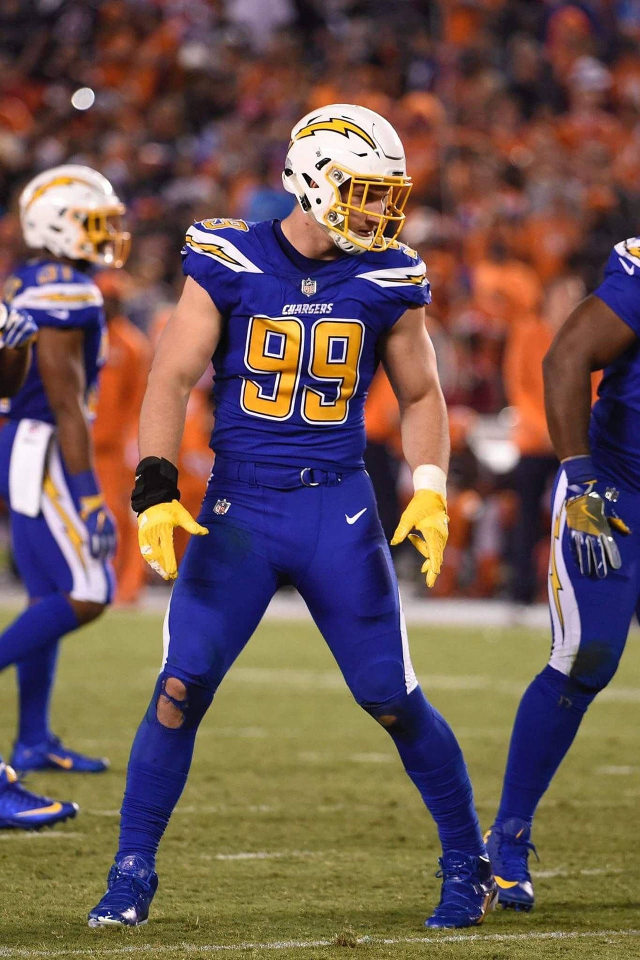1280x1920 Download Joey Bosa In Mid Game Action Wallpaper