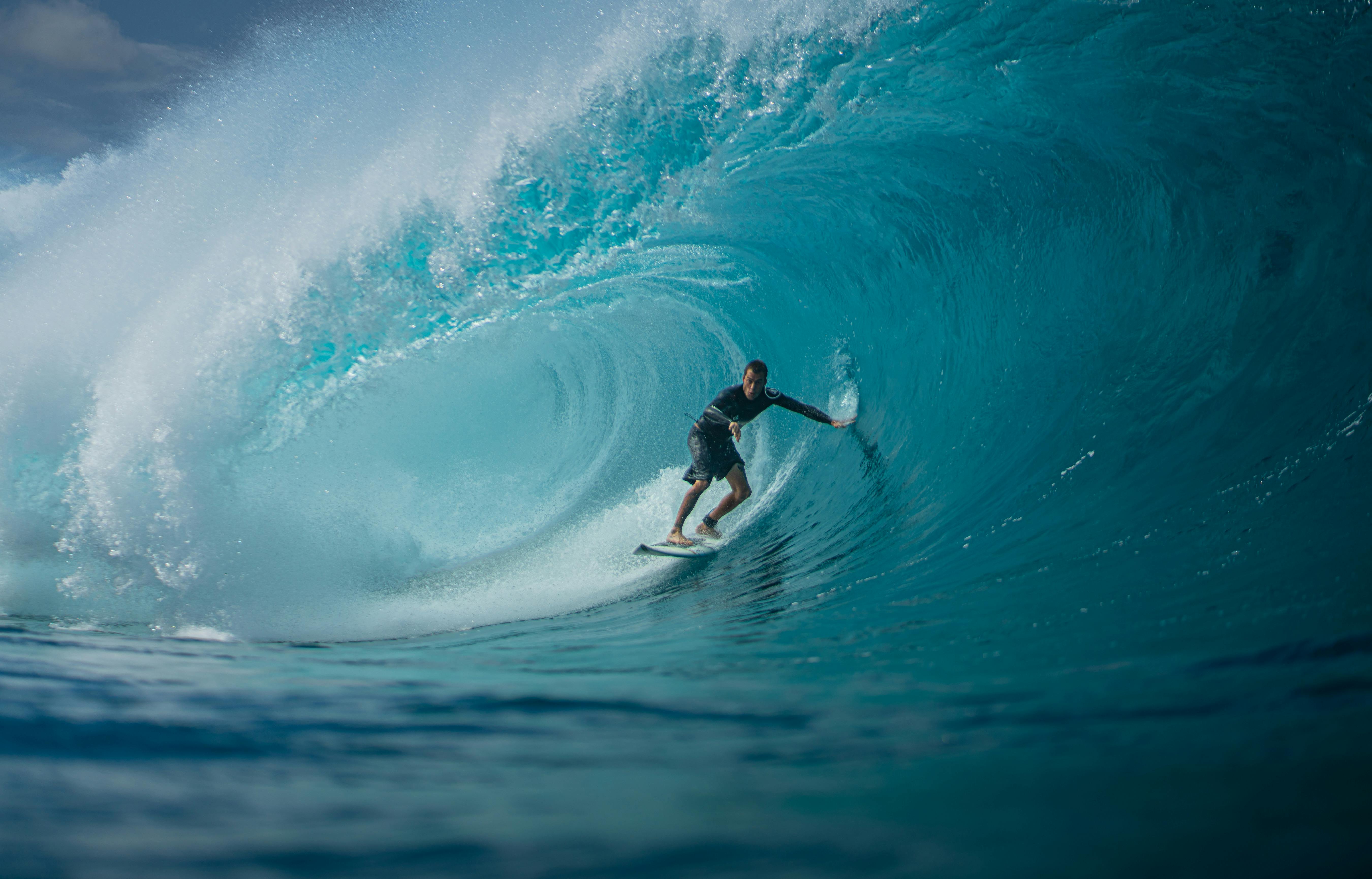 5400x3460 Man on Board Surfing in Ocean · Free