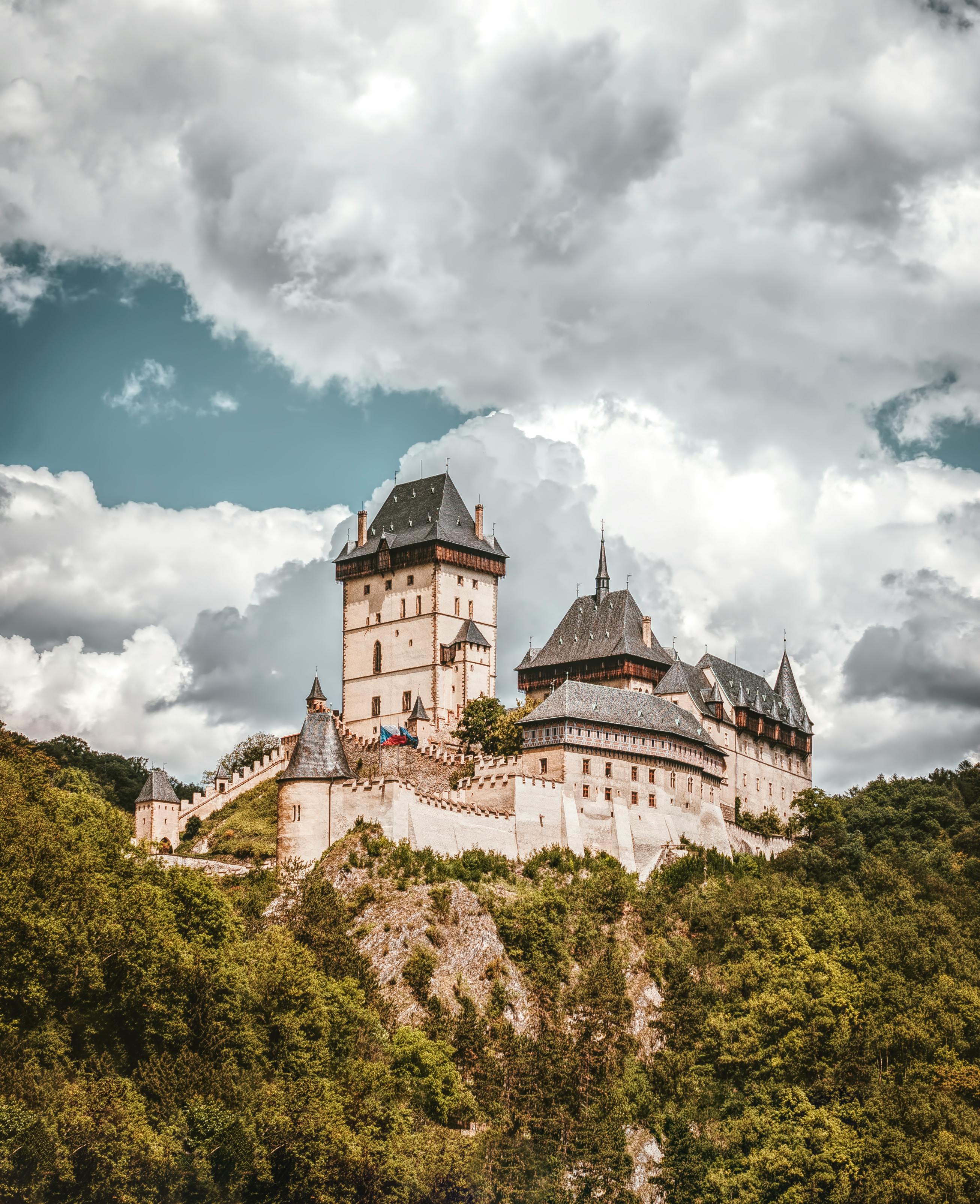 2613x3211 White and Black Concrete Castle on Mountain Under White Clouds · Free