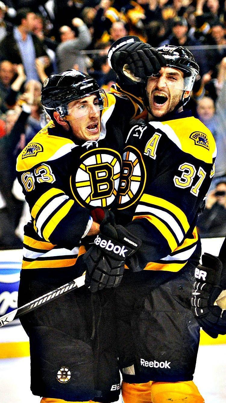 750x1334 Download Brad Marchand Celebrating With Patrice Bergeron Wallpaper