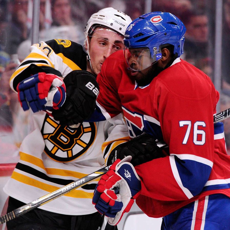 900x900 Boston Bruins Forward Brad Marchand In A Face Off Against P.k. Subban. Wallpaper