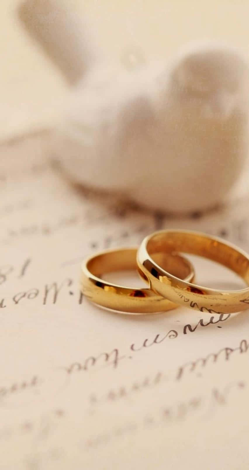 852x1608 Download Stunning Gold Engagement Rings Wallpaper