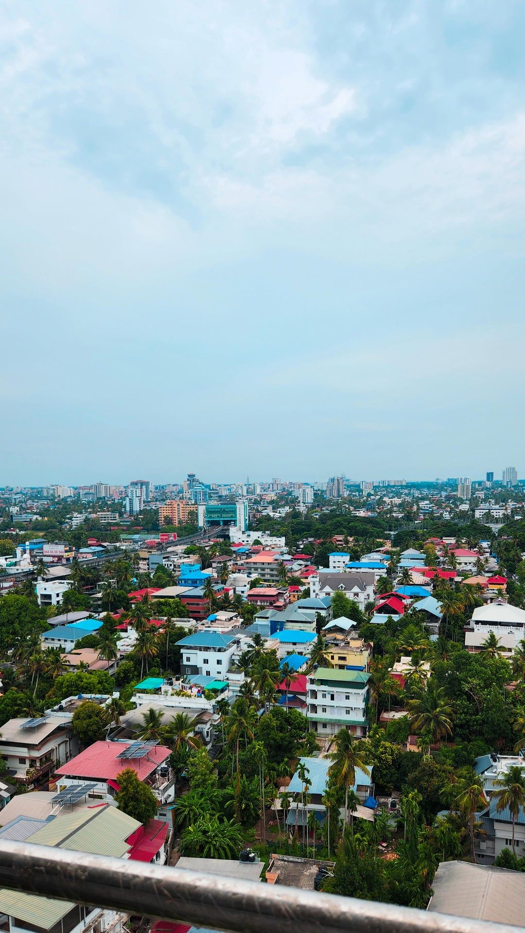 1080x1918 Enjoying a panoramic view of Kochi, offering a breathtaking perspective of the city's skyline and surroundings