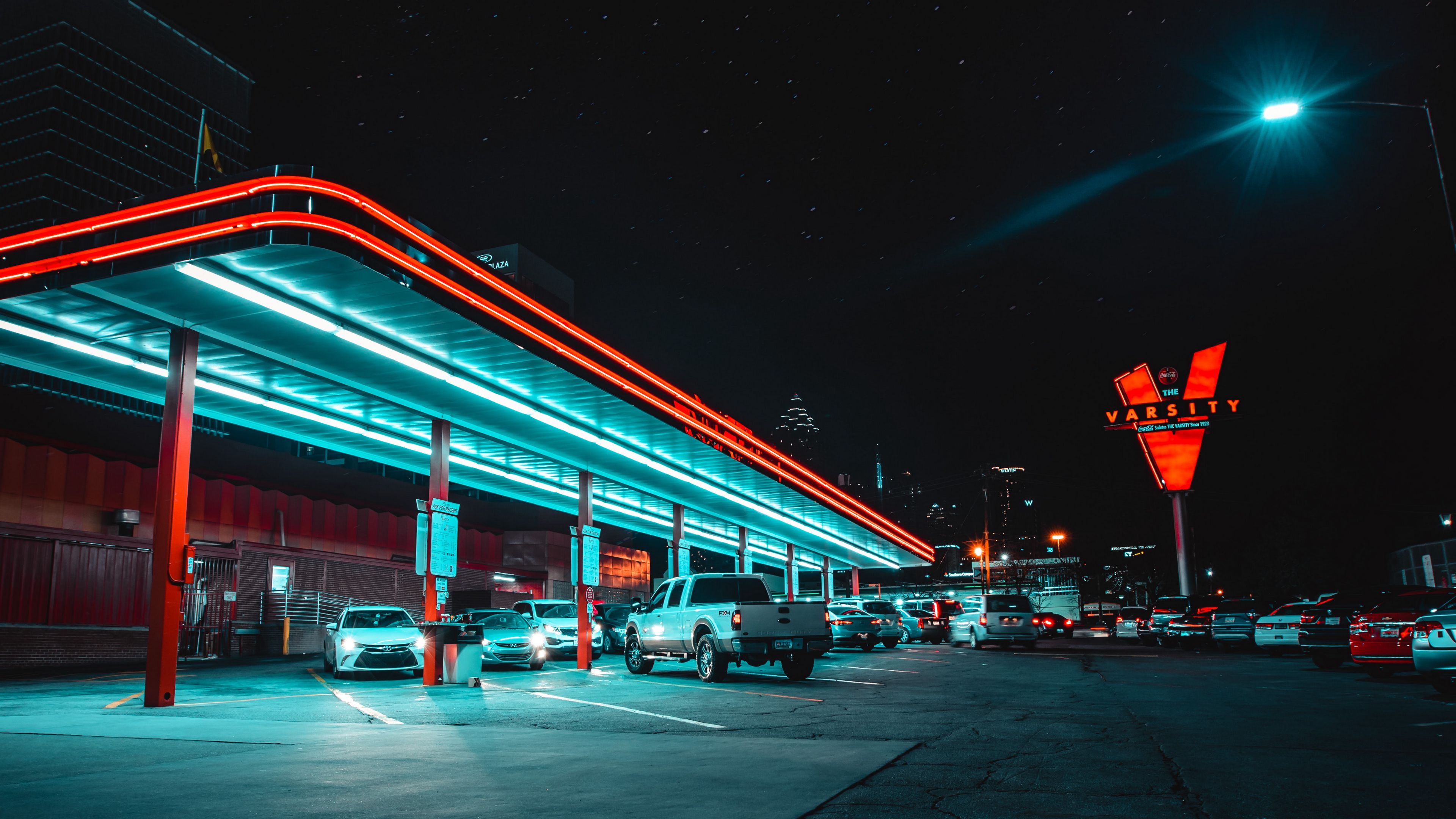 3840x2160 Download wallpaper 3840x2160 cars, parking, backlight, neon, night 4k uhd 16:9 HD background