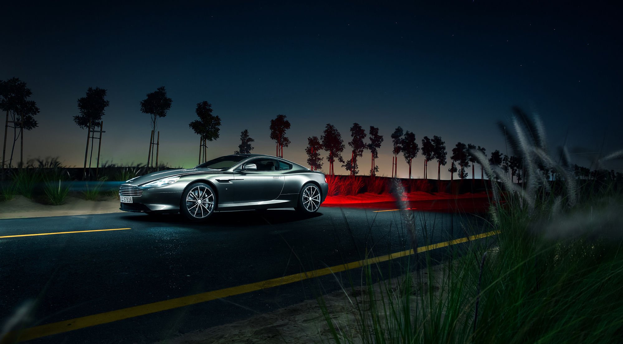 2000x1104 Download Night Car Silver Car Supercar Aston Martin Vehicle Aston Martin DB9 HD Wallpaper