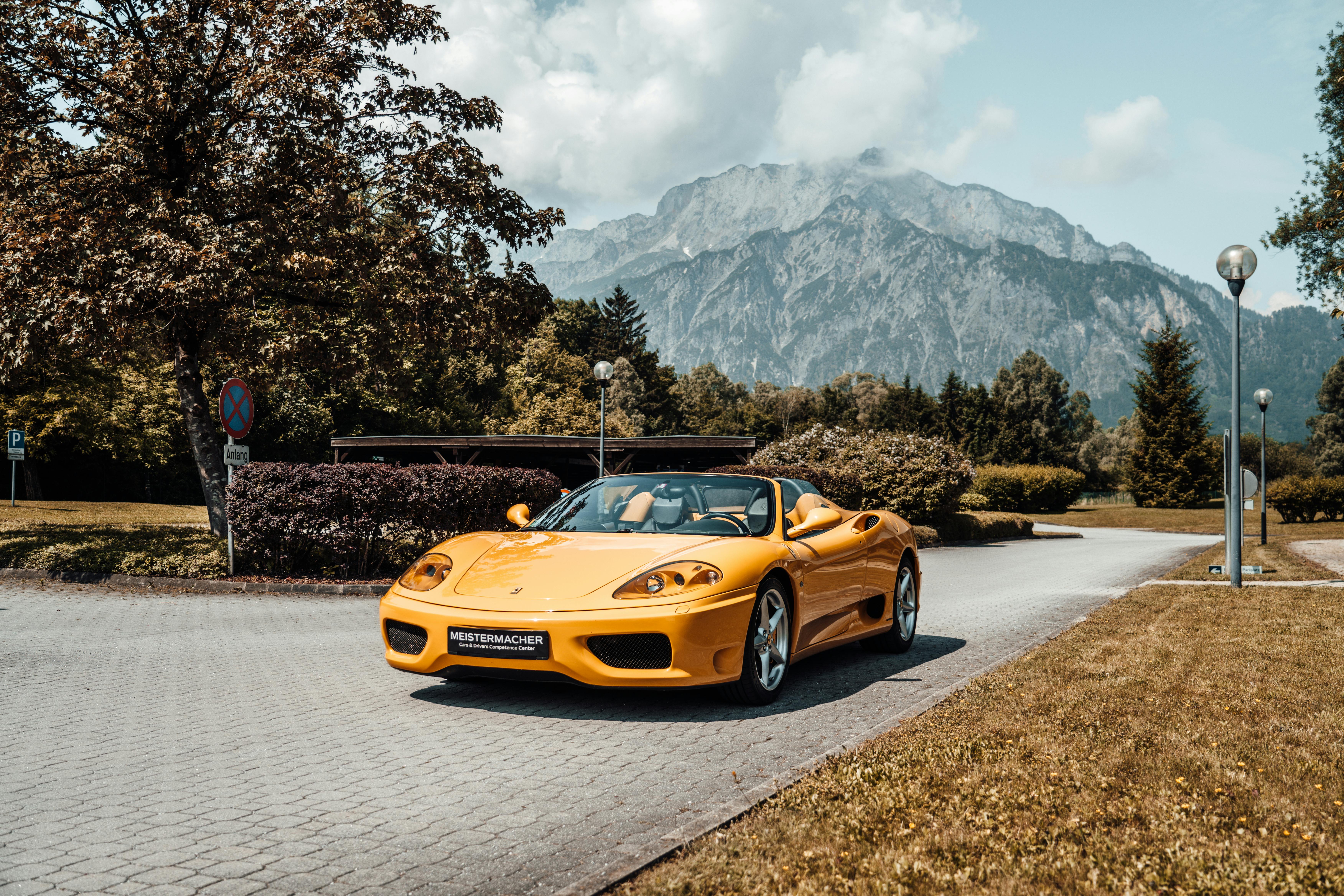 7008x4672 Yellow Sports Car in a Mountain Landscape · Free