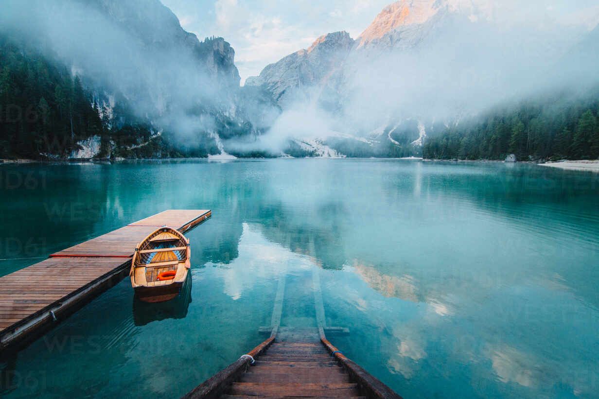 1232x821 From above wooden quay on amazing scenery of lake with turquoise water in mountains on foggy day