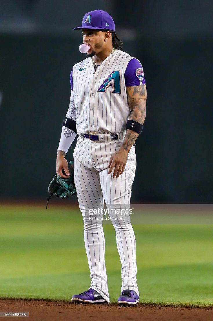 735x1105 Ketel Marte of the Arizona Diamondbacks blows a bubble while waiting