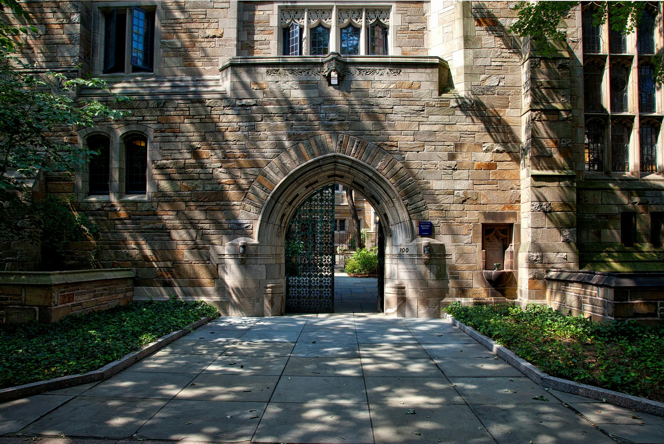 2200x1470 Steel Gate of Brown Brick Building · Free