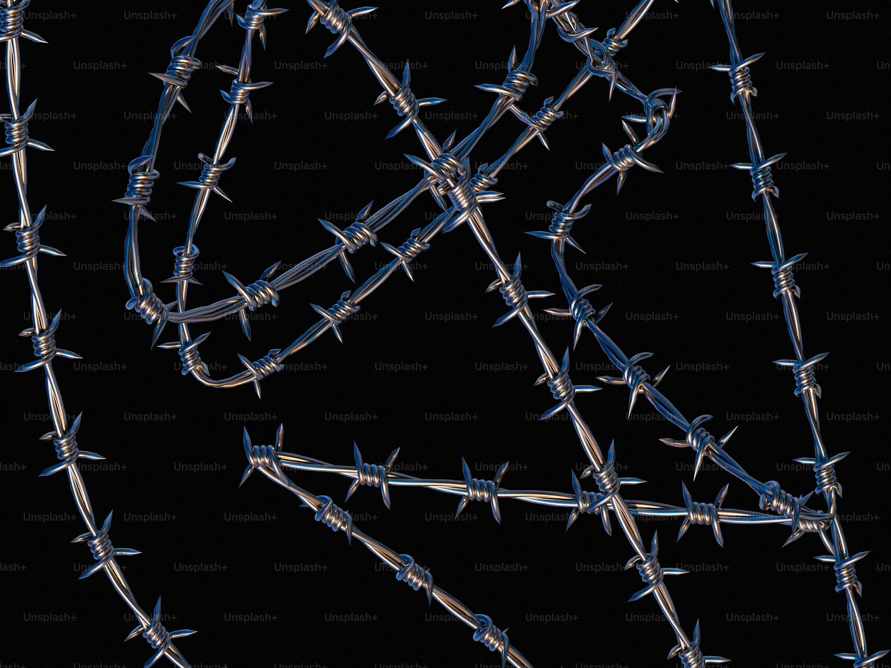 3000x2250 A bunch of barbed wire on a black background photo