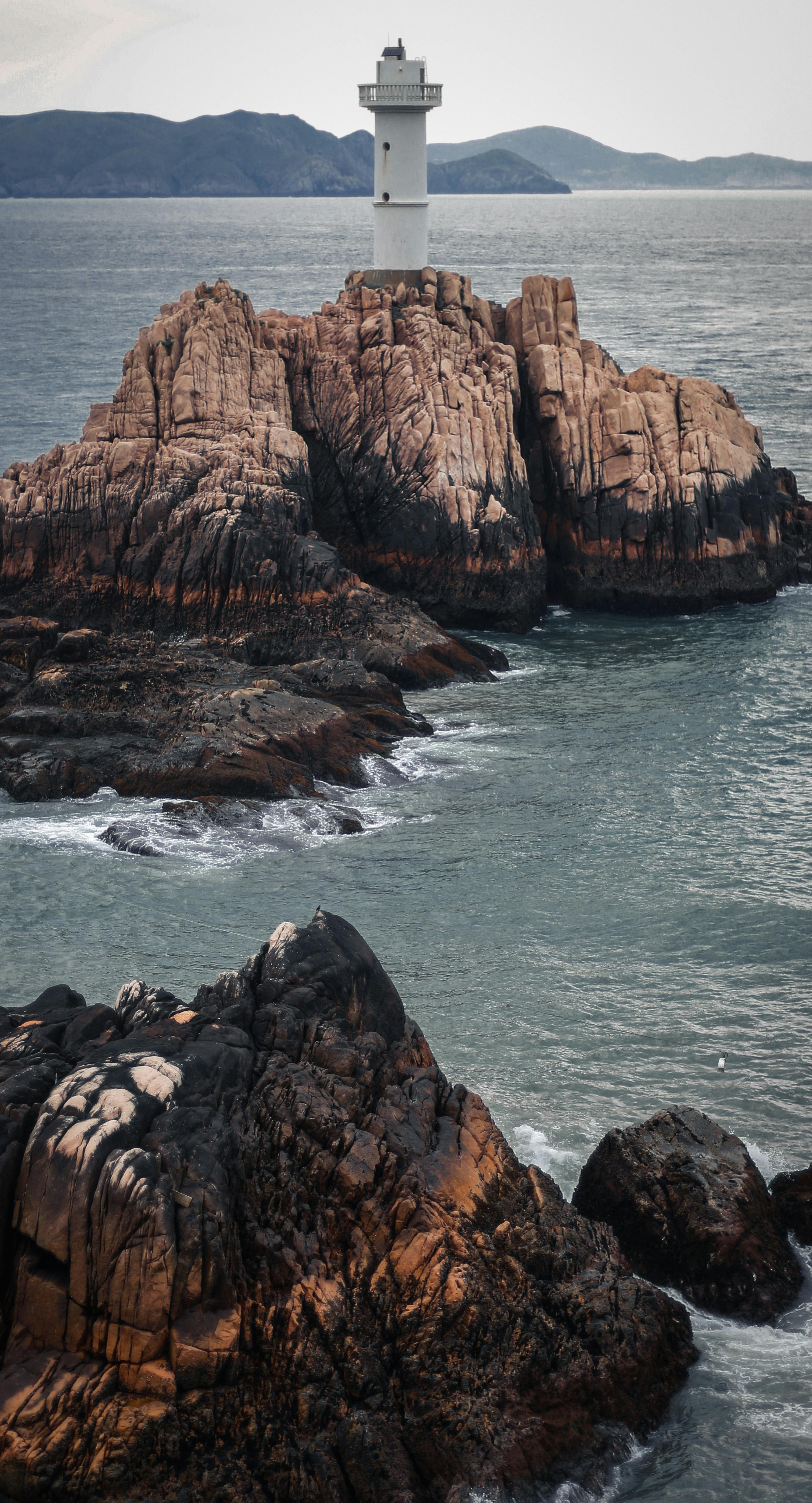 2802x5184 Lighthouse on a Rocky Shore · Free
