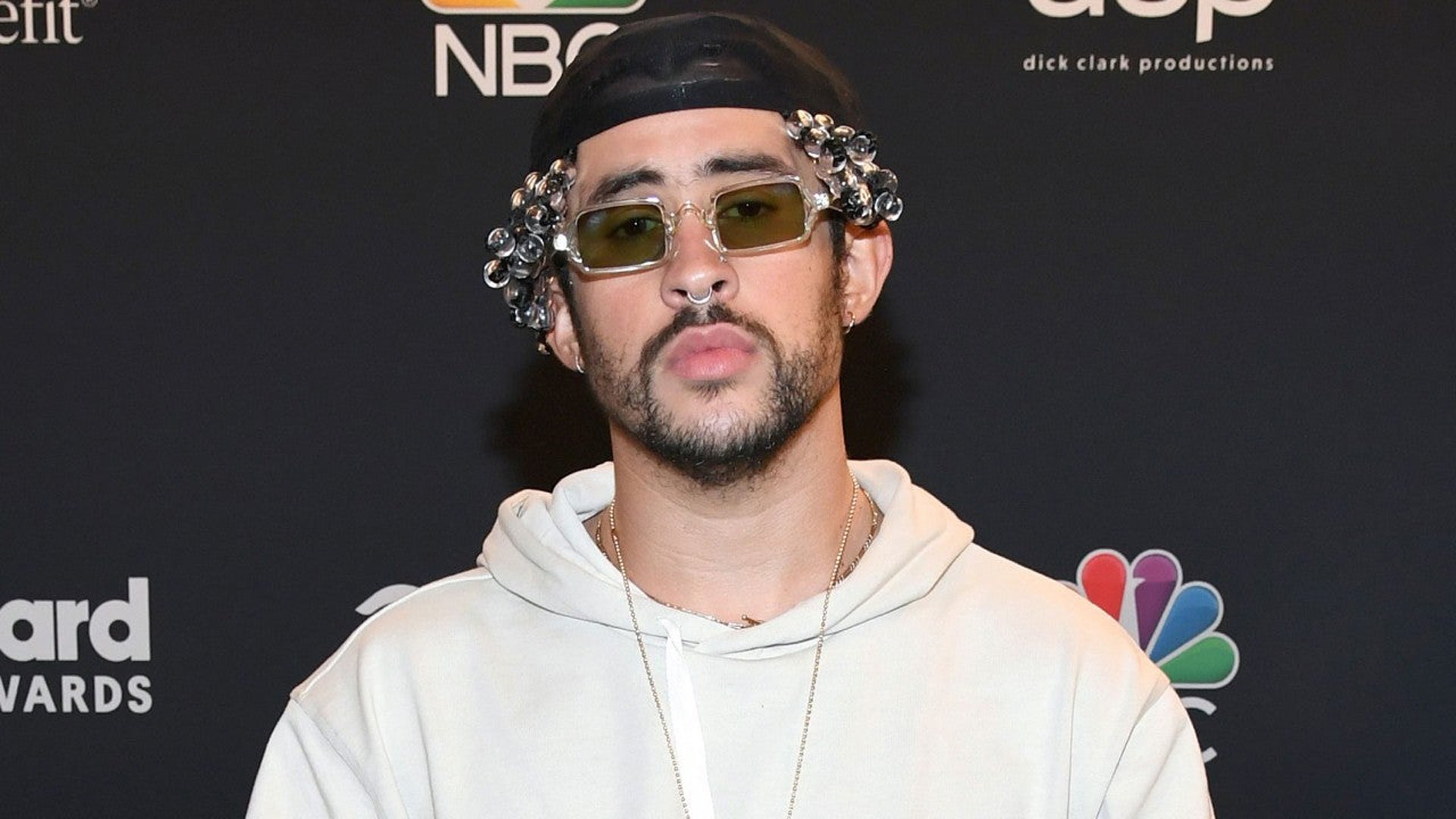 1920x1080 Bad Bunny Is Wearing White Dress Standing In Black Background HD Bad Bunny Wallpaper