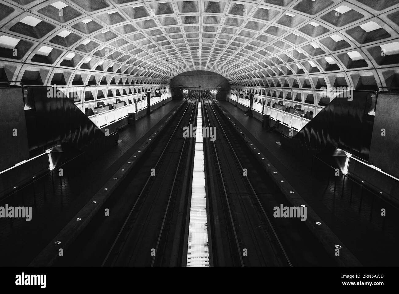 1300x956 Metro station platform, Washington, D.C. Black and white photograph showing the symmetrical perspective of the tracks and coffered ceiling
