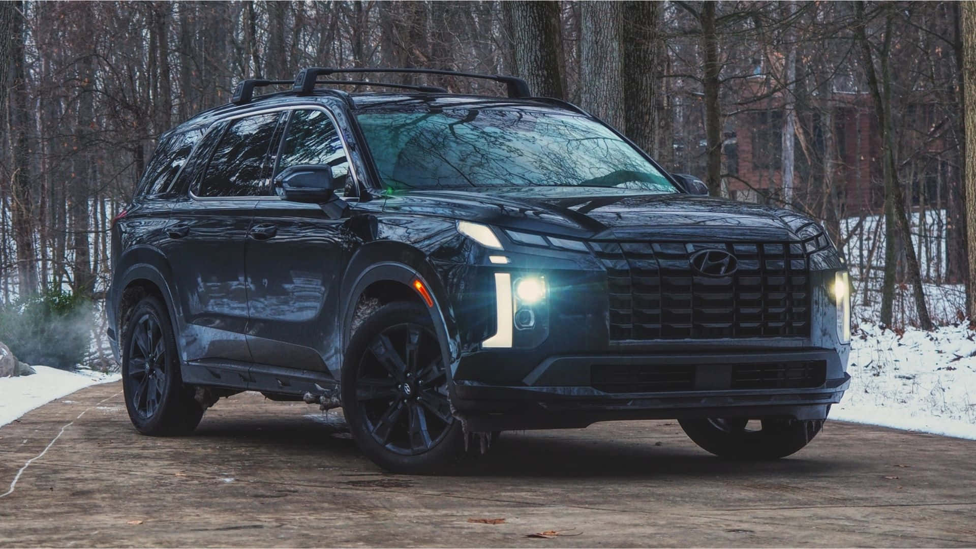 1920x1080 Download Sleek And Stylish Hyundai Palisade Cruising On The City Streets. Wallpaper