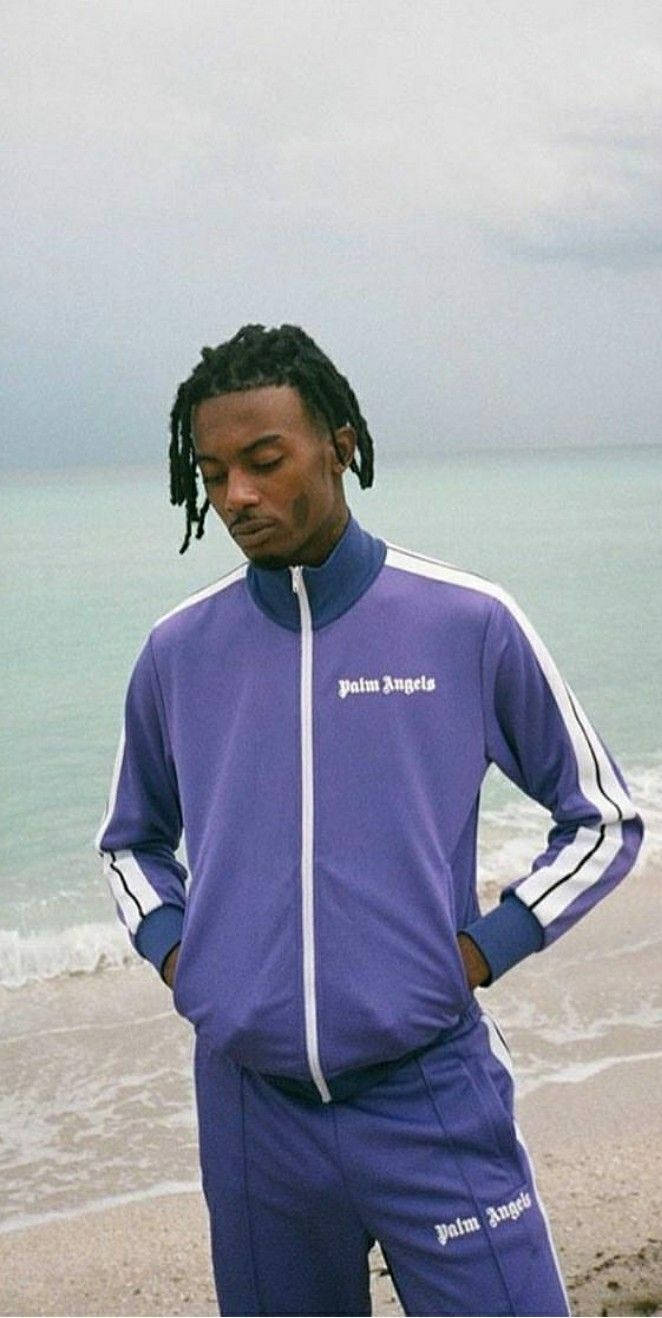 662x1318 Download Playboi Carti looking stylish in purple tracksuit Wallpaper