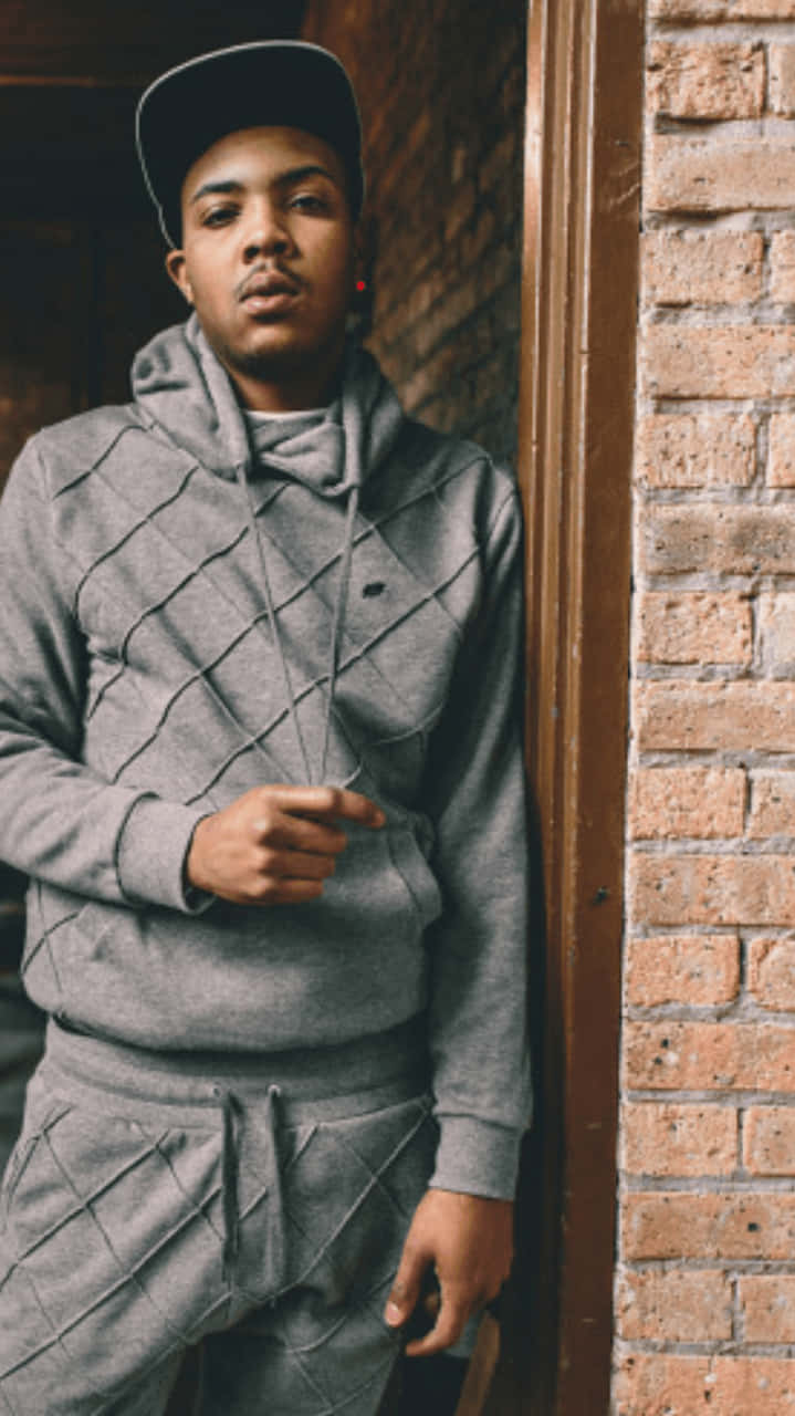 719x1280 Download A Young Man In A Grey Hoodie And Tracksuit Wallpaper