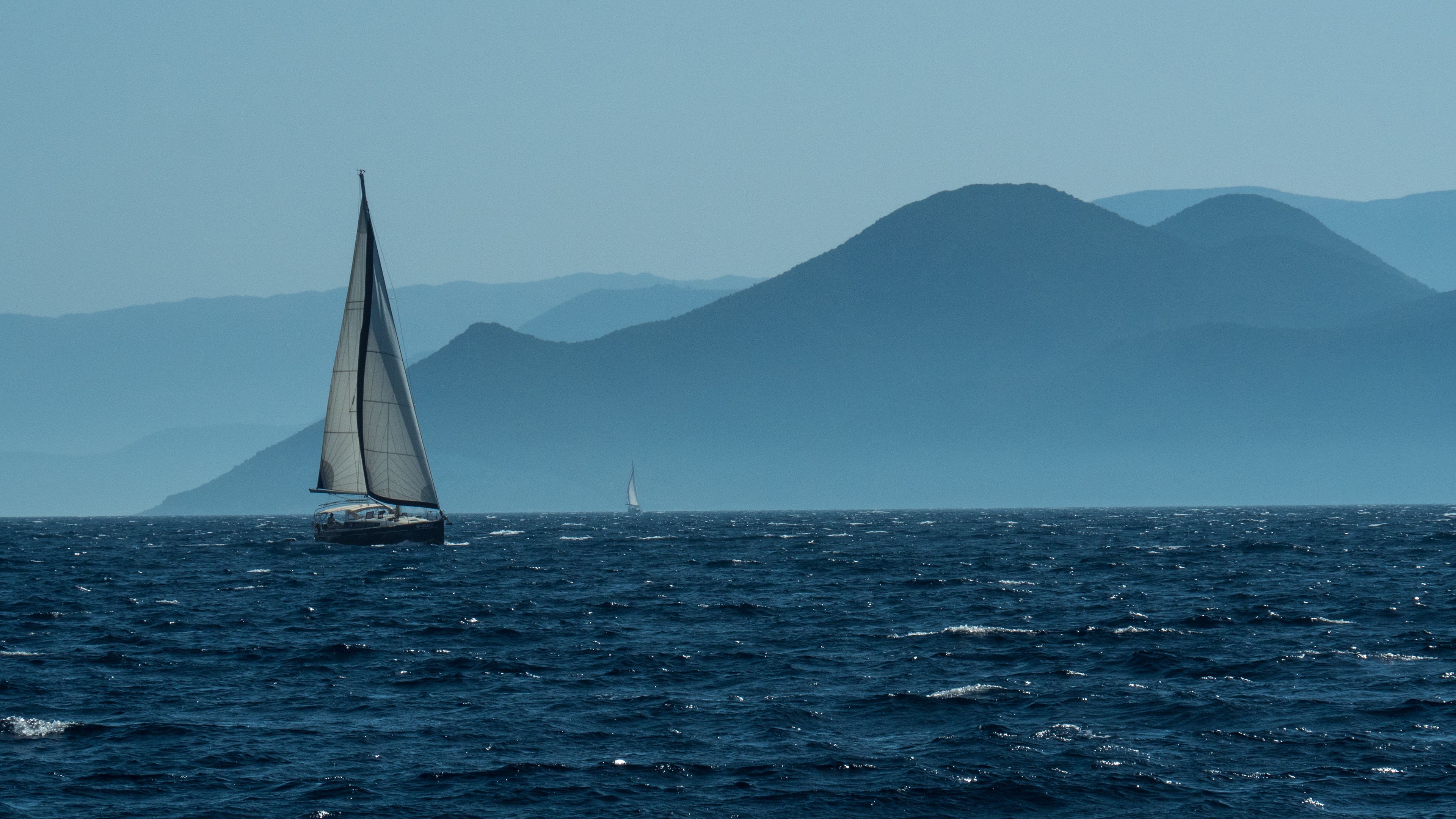 3840x2160 Download wallpaper 3840x2160 sailboat, boat, water, sea, mountains, landscape 4k uhd 16:9 HD background