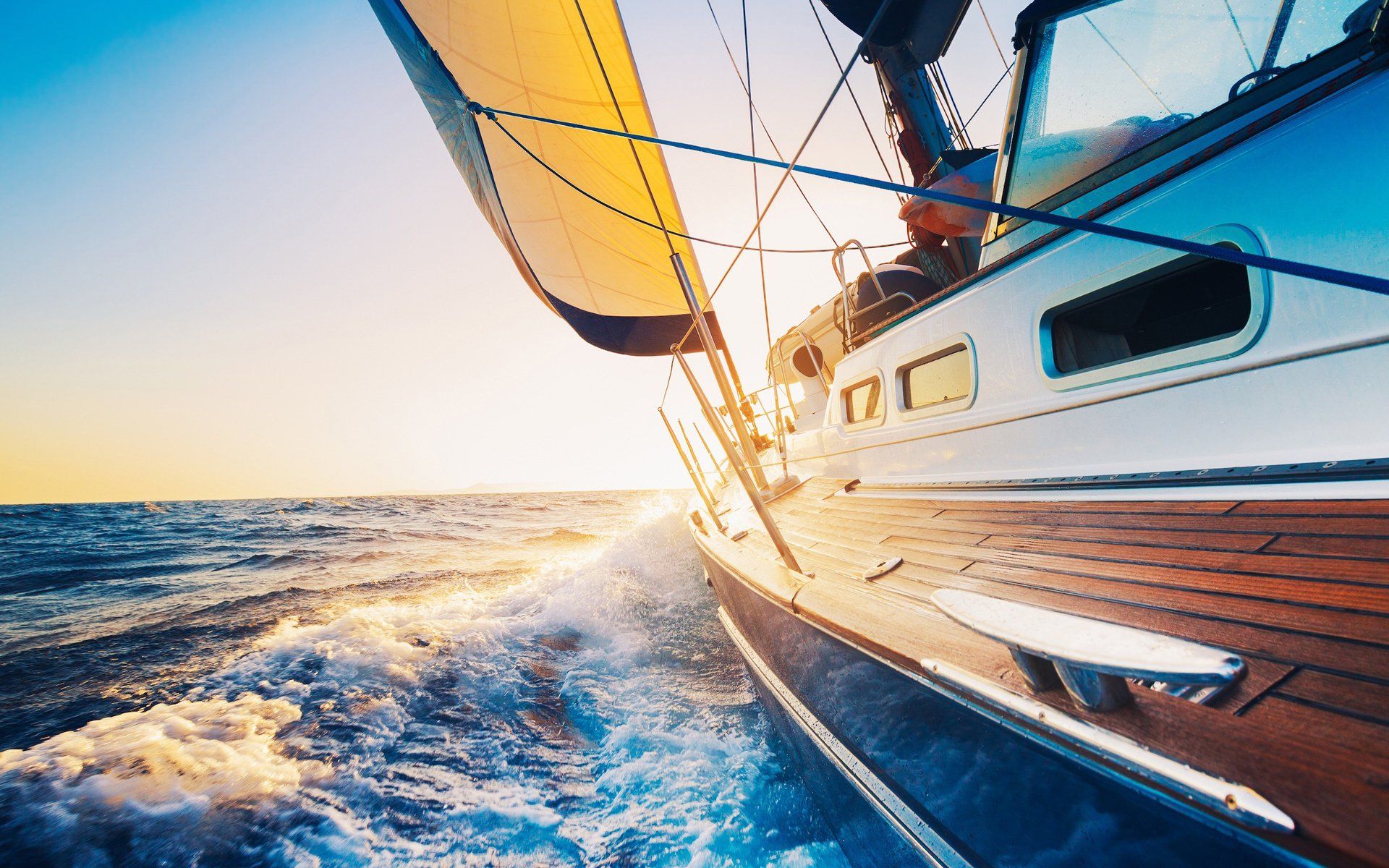 1920x1200 HD Wallpaper of a Sailboat Gleaming on the Water
