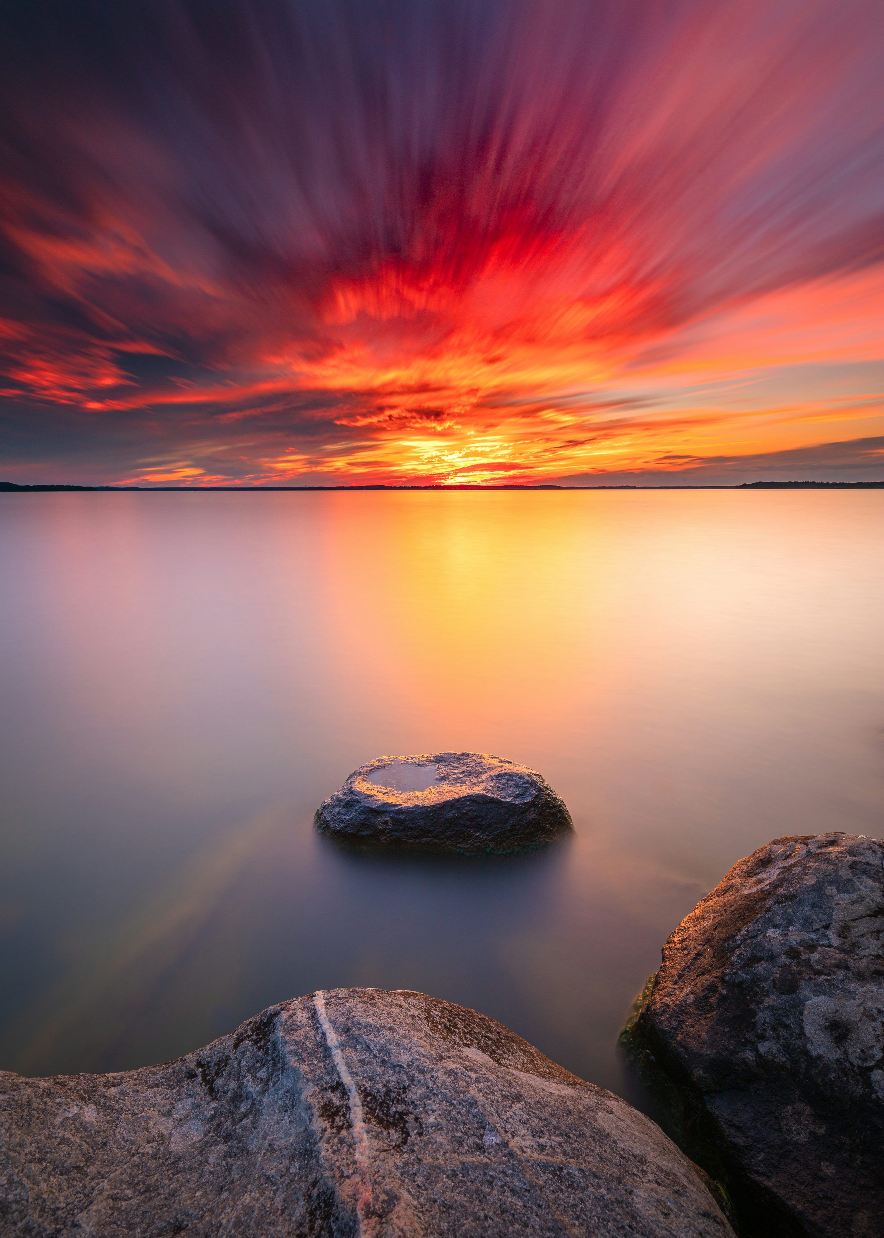 3000x4200 Gray rock formation on body of water during sunset photo