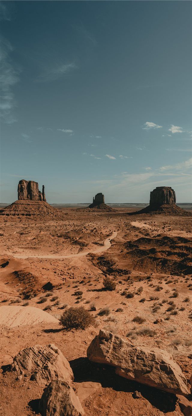 640x1385 brown rock formation under white clouds during day. iPhone X Wallpaper Free Download