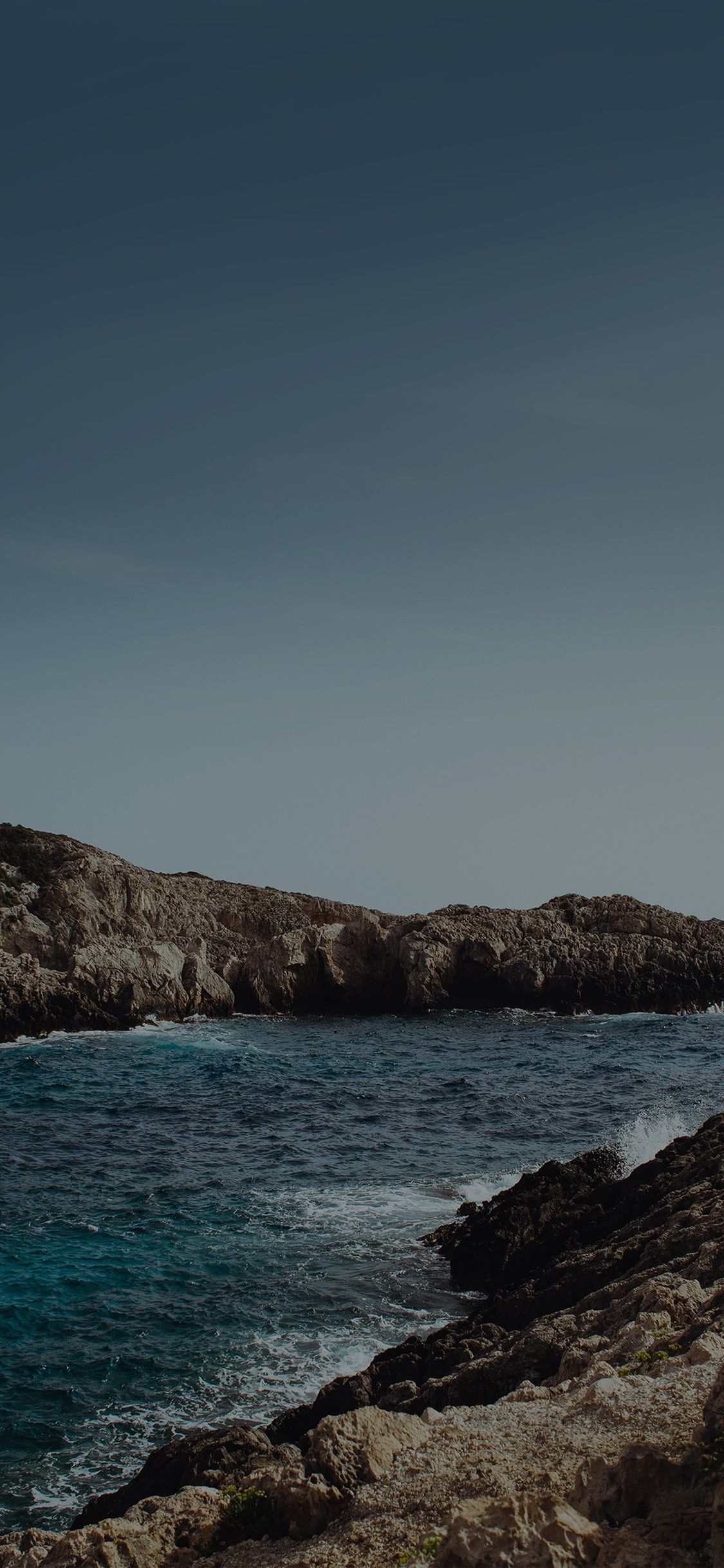 1125x2436 iPhone X wallpaper. one sunny day beach rock sea nature dark