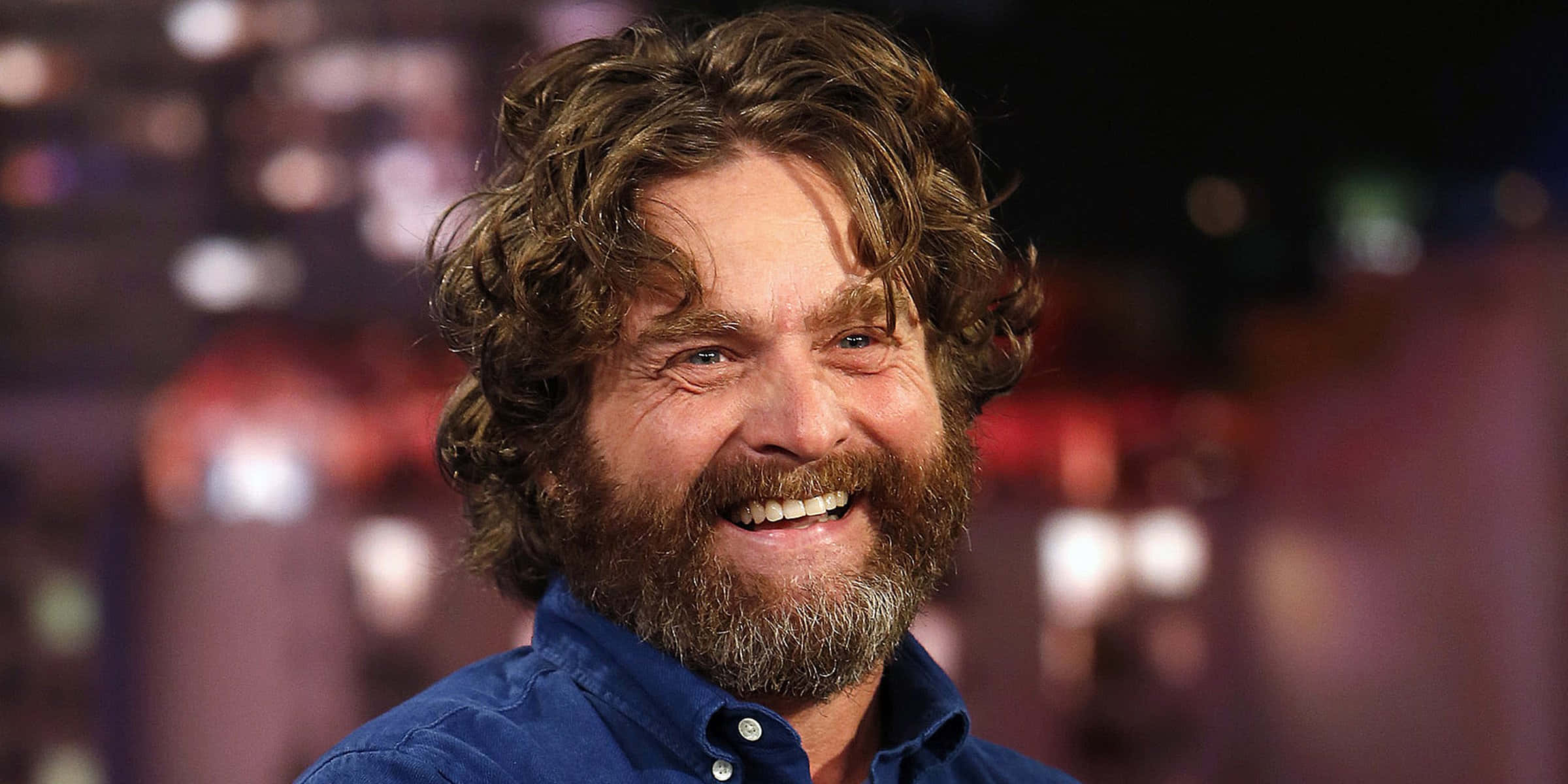 2400x1200 Download Comedian Zach Galifianakis looking off into the future Wallpaper