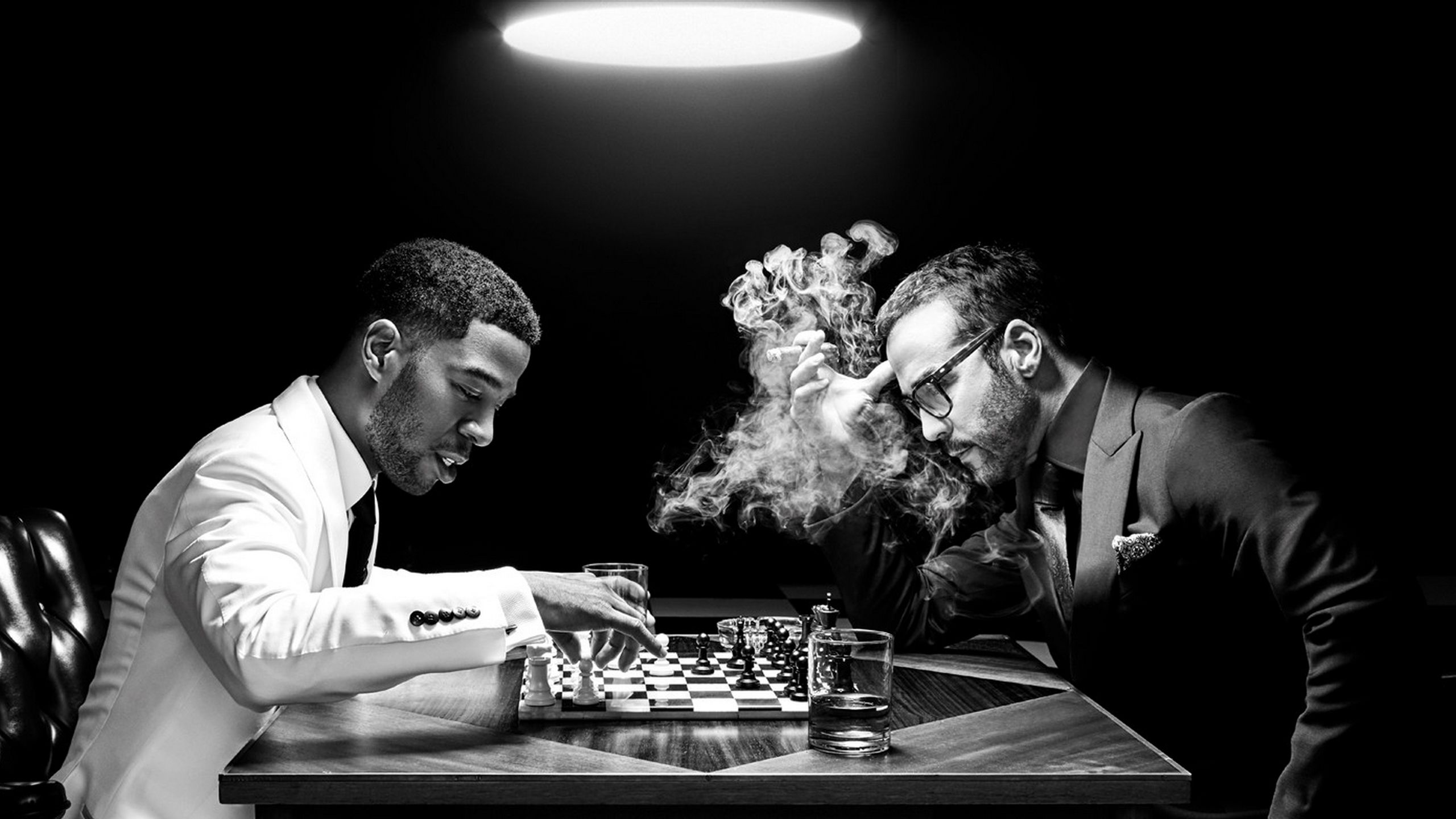 2560x1440 Kid Cudi And Jeremy Piven Are Playing Chess HD Rapper Wallpaper