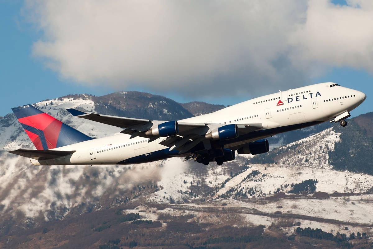 1200x800 Download Delta Airlines Airplane Flying By Mountains Wallpaper