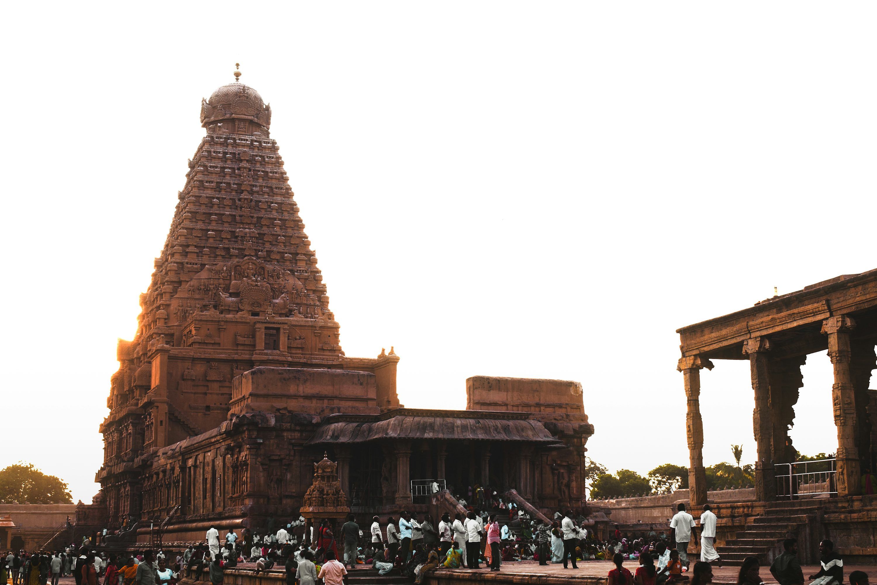 3000x2000 A large temple with people standing around with Brihadeeswarar Temple in the background photo