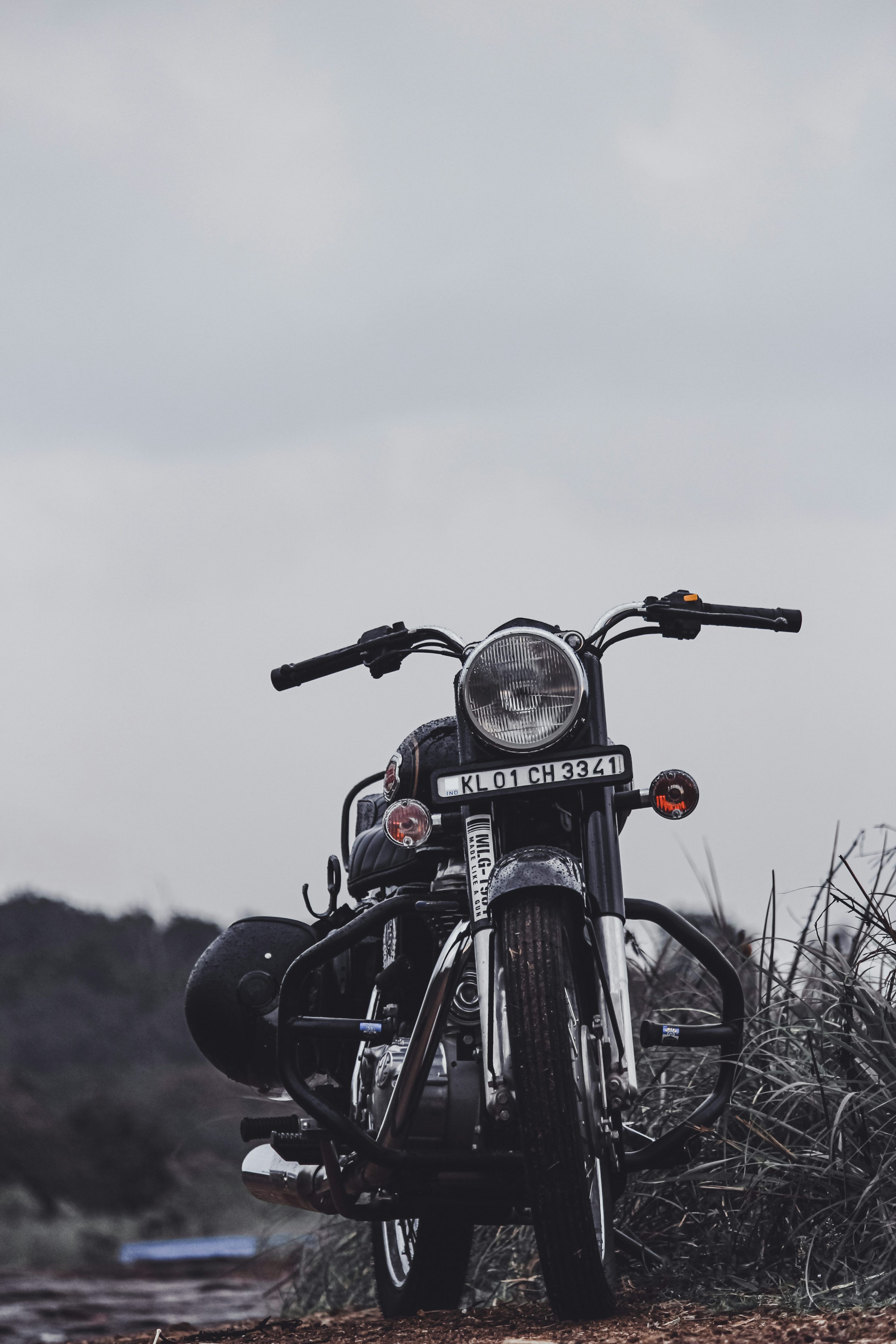 3000x4500 Black motorcycle on brown grass field during daytime photo