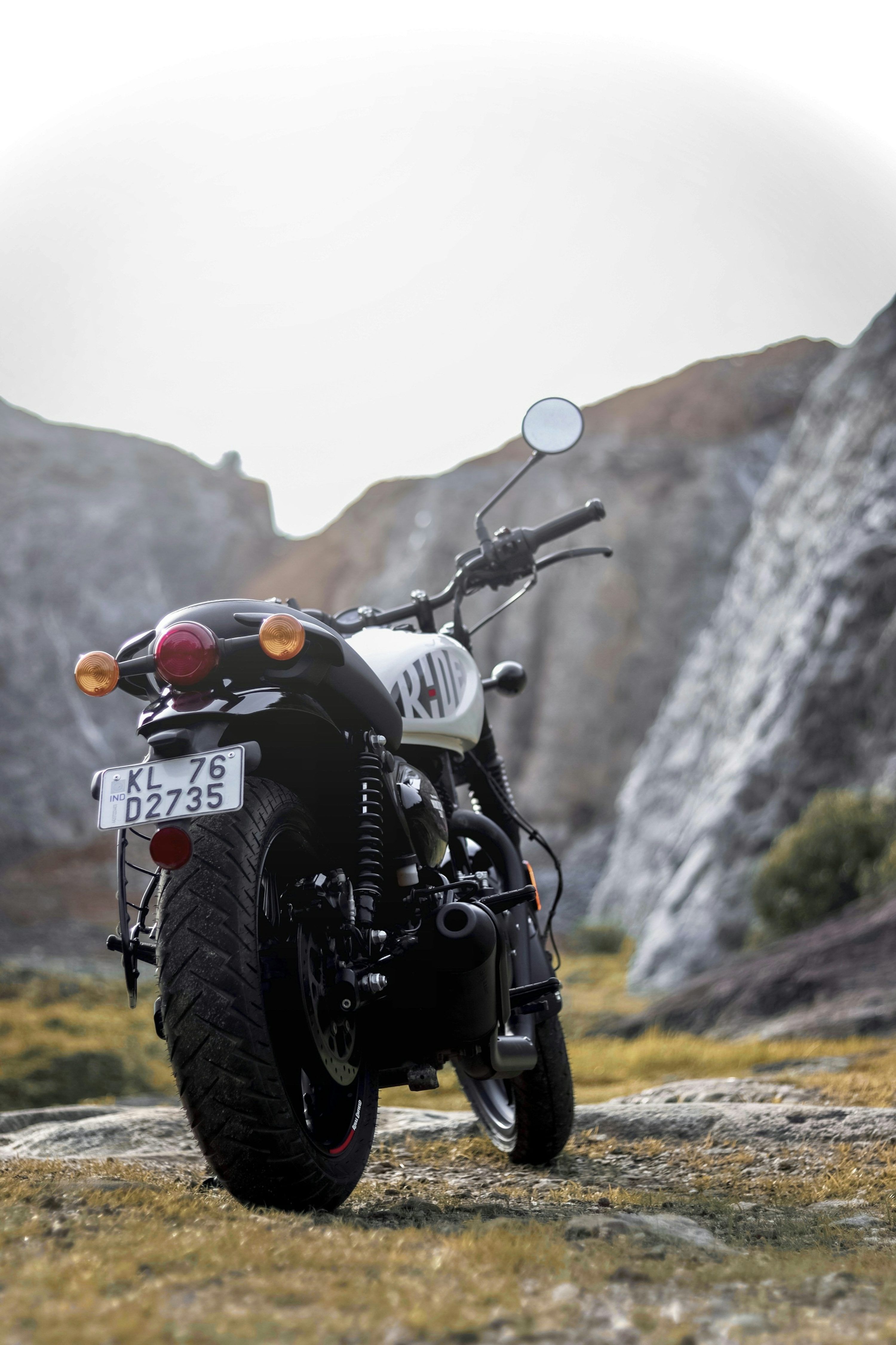 3000x4500 A motorcycle parked on the side of a mountain photo