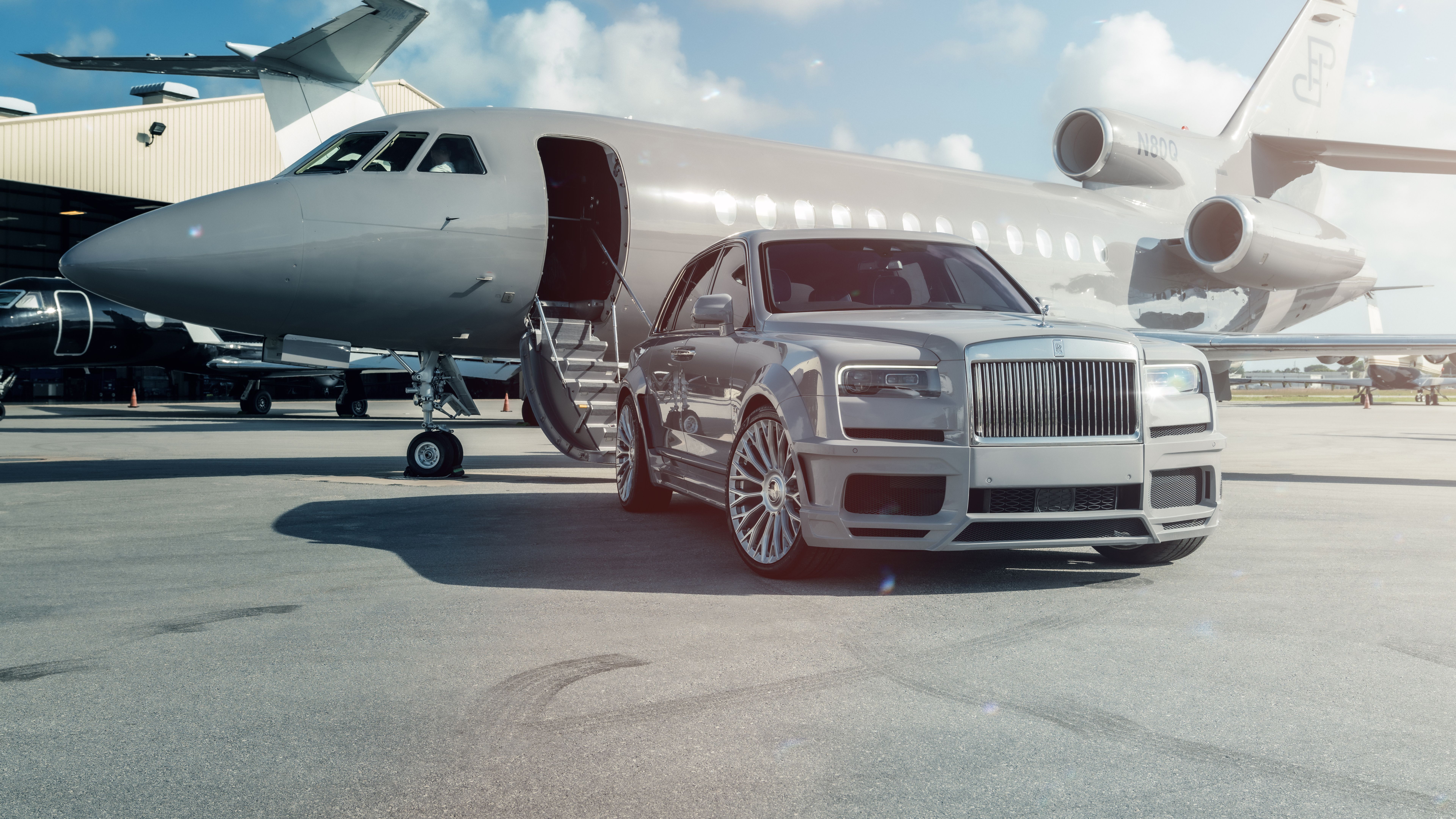 7680x4320 Rolls Royce With Plane Wallpaper