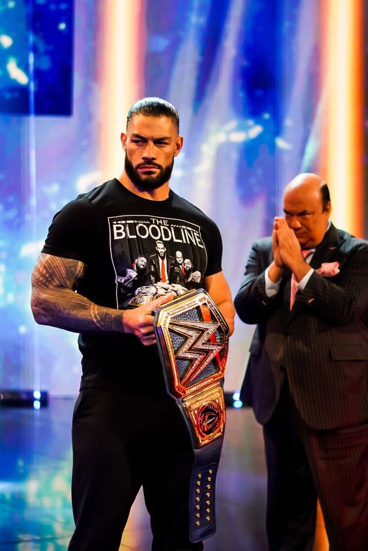 736x1101 Universal Champion Roman Reigns With Paul Heyman