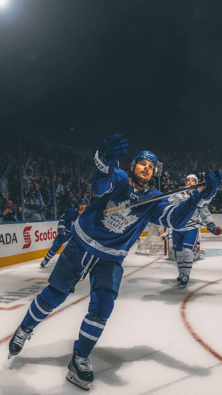 750x1334 Download John Tavares Nhl Toronto Maple Leafs Photo Wallpaper