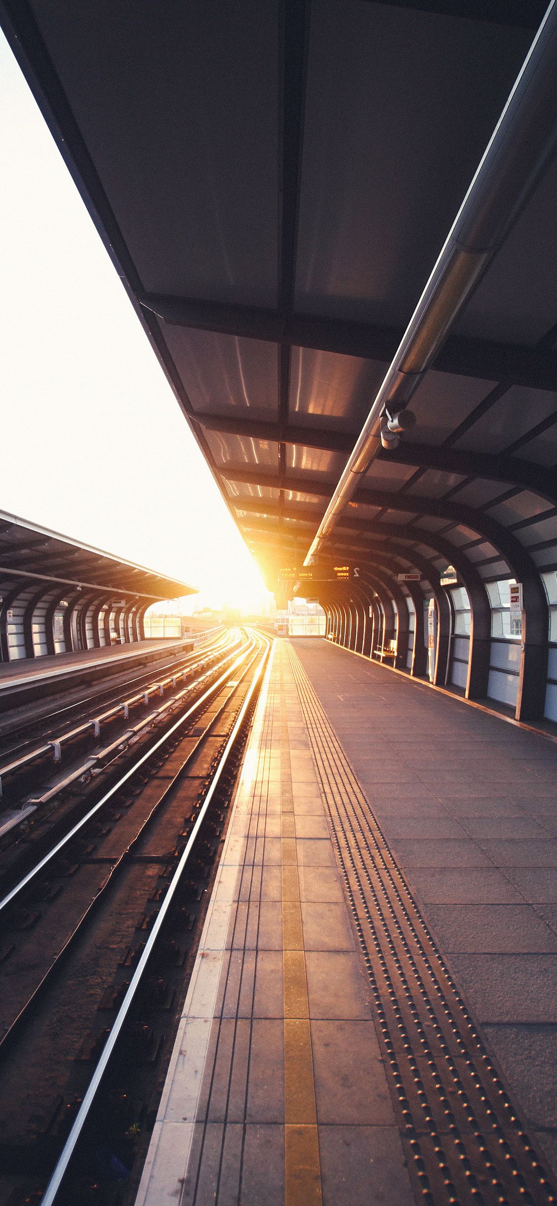 1125x2436 iPhone X wallpaper. train station s charles city blue sun
