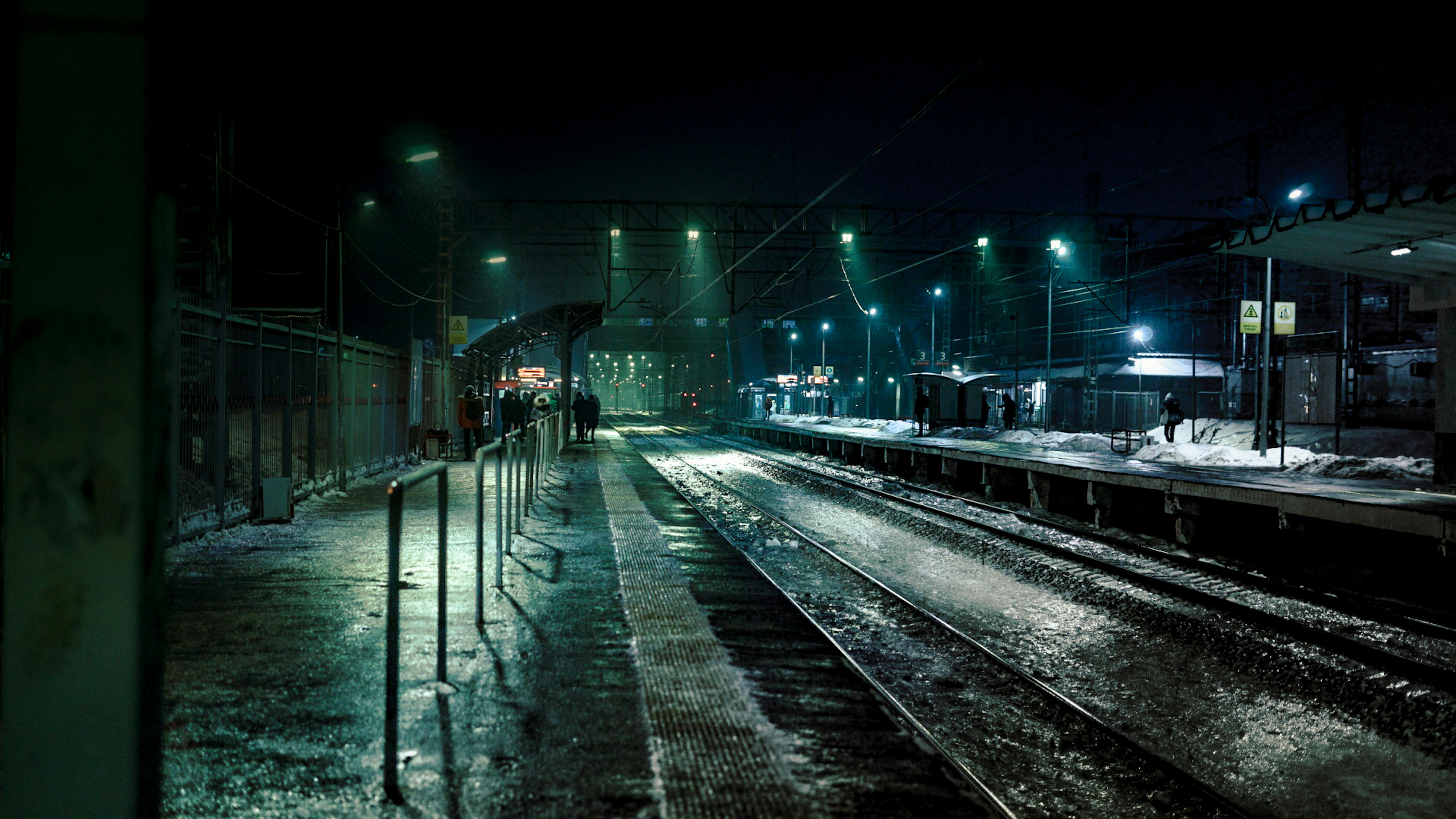 6400x3600 People Waiting at a Train Station at Night · Free