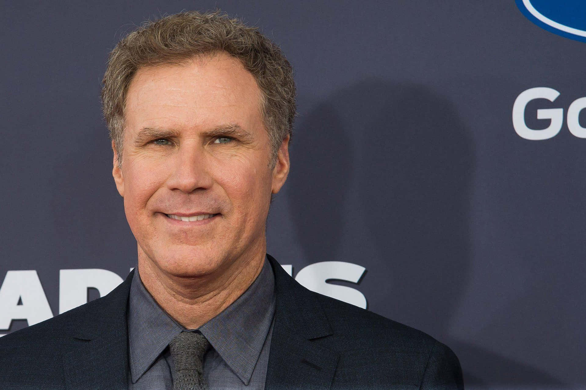 1920x1280 Download Will Ferrell striking a funny pose while holding a basketball in a promotional photo shoot. Wallpaper