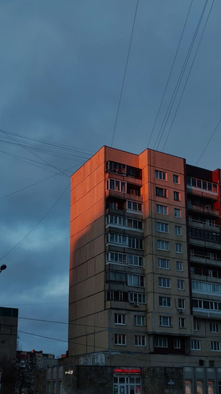 736x1307 Orange Building with Lots of Windows