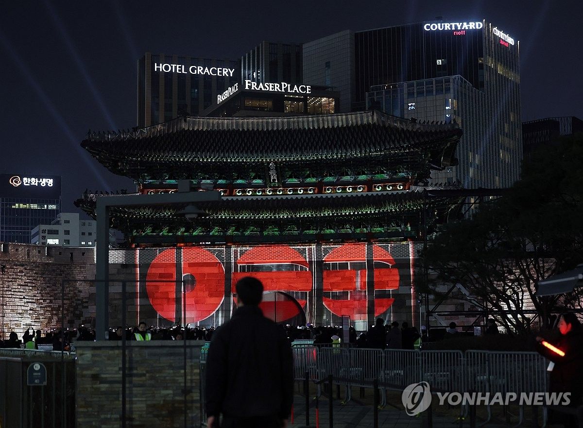 1200x882 Seoul glows red as fans gather to celebrate new BTS album 'Arirang'. Yonhap News Agency